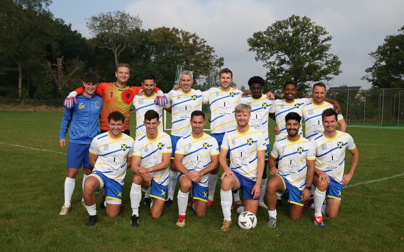 Old Albanians FC team photo in the white One Percent Club kit