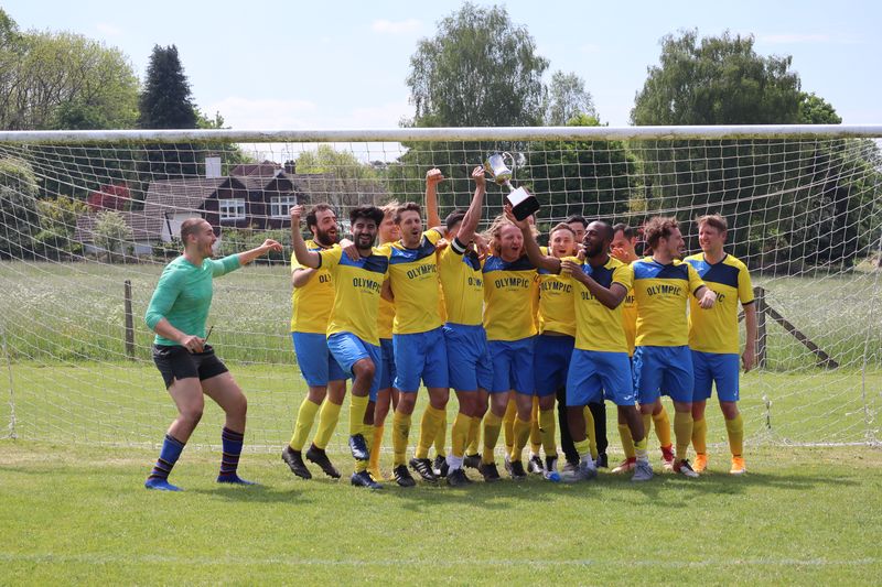 Old Albanians FC squad celebrating with the David Woolcott Trophy